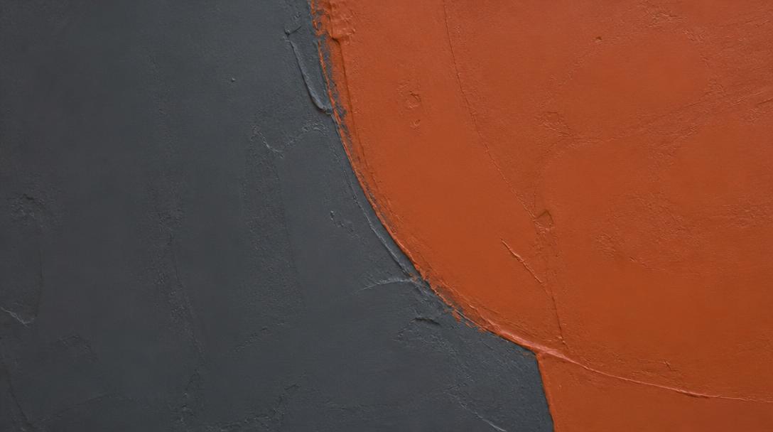 Smooth industrial paint texture in deep gray and terracotta